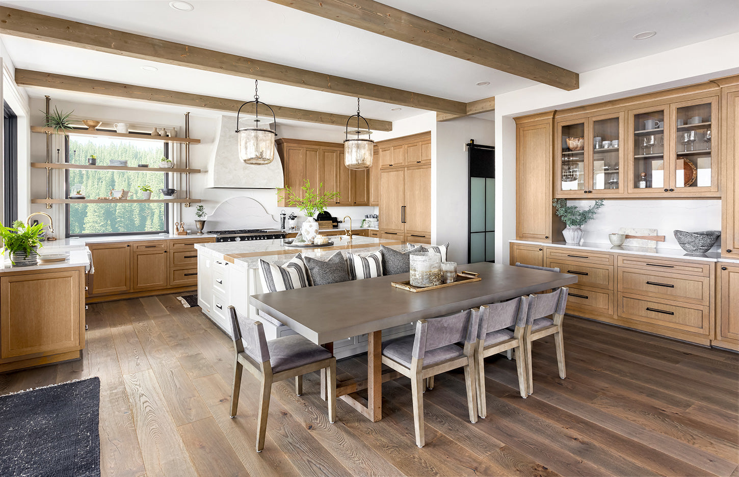 Photo of kitchen with wood flooring and cabinetry with natural oil finish.